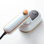 Roomlift Mini Rotating Steam Iron in white — studio