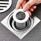 Roomlift drain strainer in a floor drain
