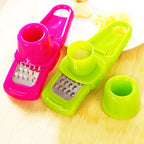 Roomlift garlic press on a cutting board with garlic